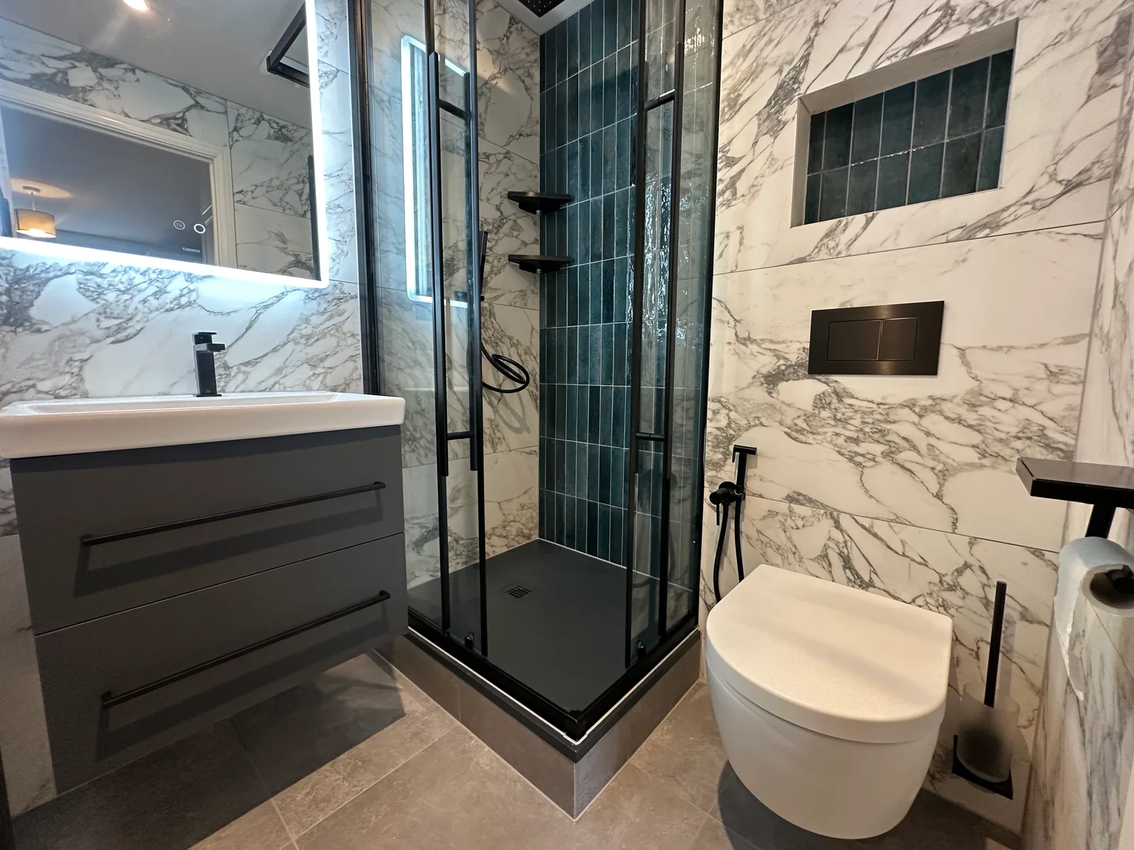 Two complete bathroom renovations in Tuffley, Gloucester 13 Shower Enclosure, Wall-Hung Toilet And Recessed Storage In The Second Tuffley Bathroom.